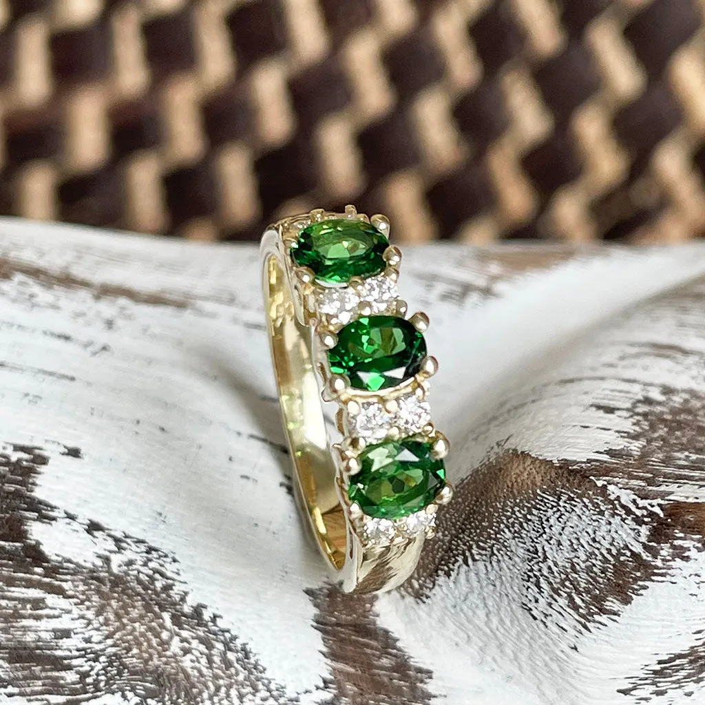 Gorgeous Trilogy Oval Tsavorite and Double Diamond Accent Ring